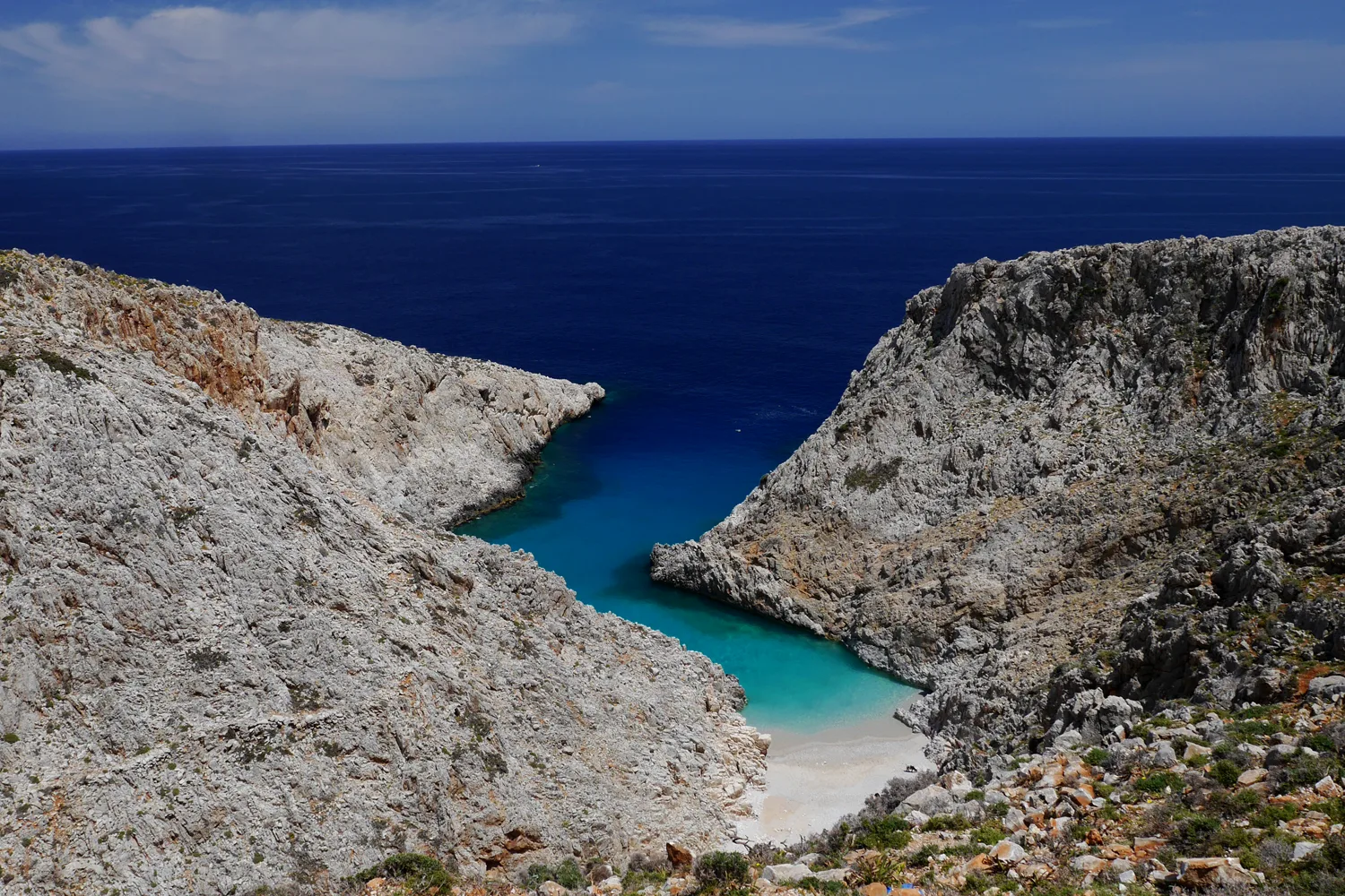Coastal view and clear turquoise waters at Seitan Limania, a picturesque bay on the Cretan coast.